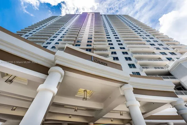 a view of a swimming pool with an outdoor seating