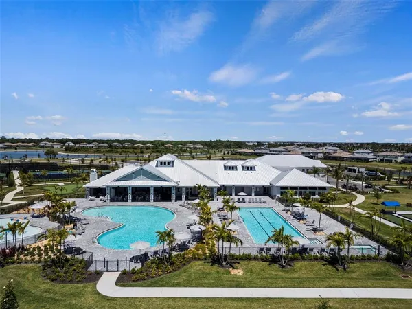 an aerial view of a house with outdoor space