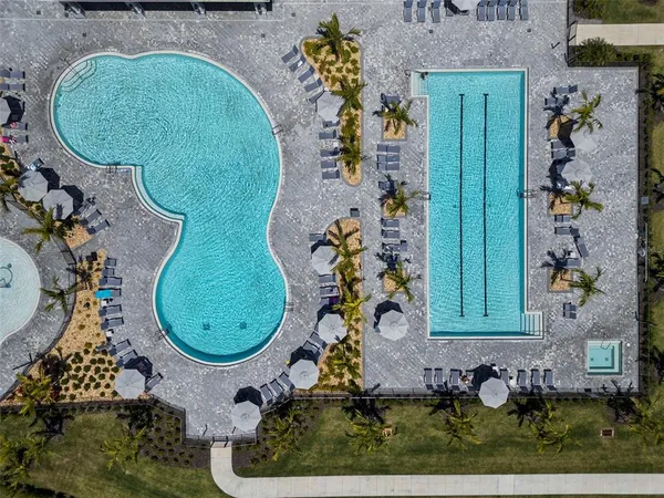 an aerial view of a swimming pool and mountain view