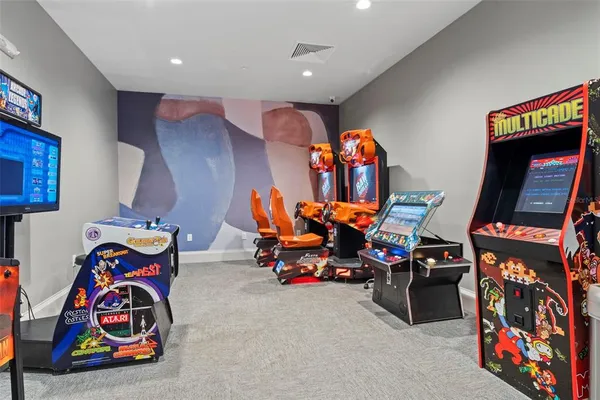a living room with furniture a potted plant and a potted plant