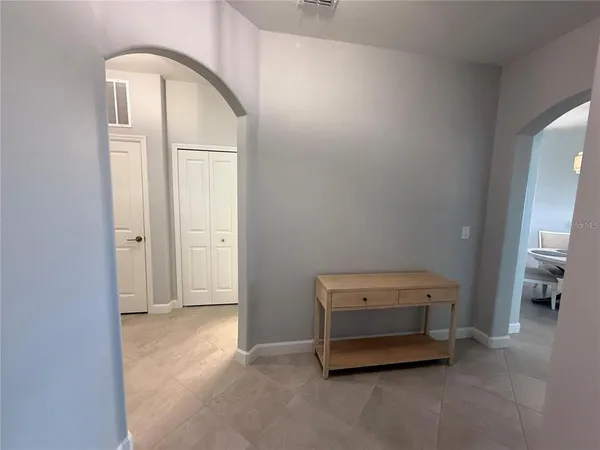 a dining room with furniture and window