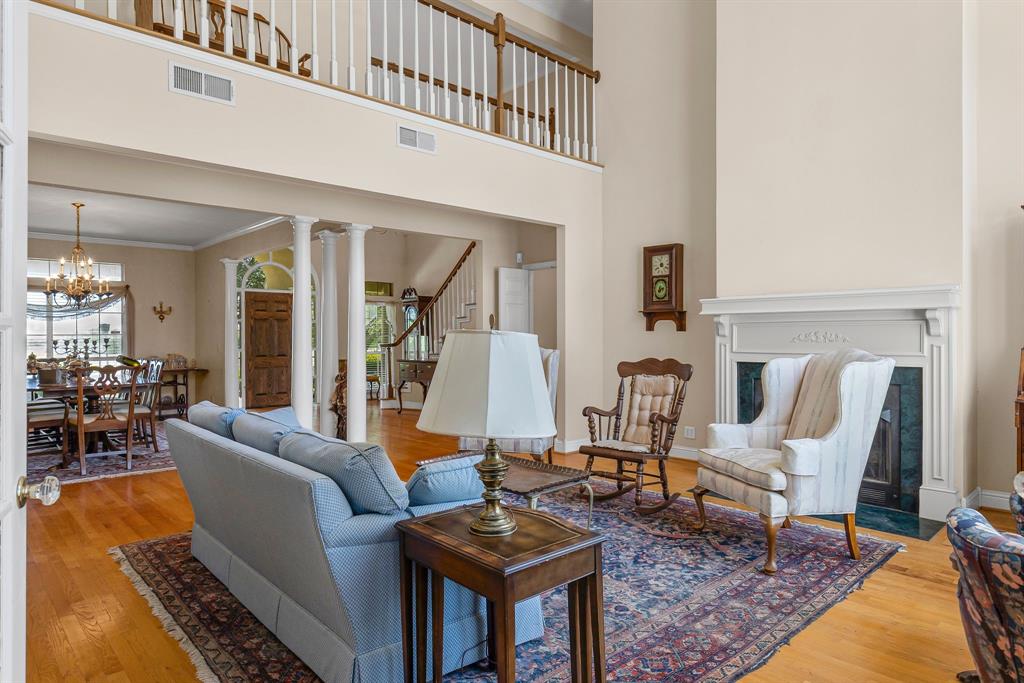 7581 Highway 24 Commerce, TX 75428 - Photo 11 of 40 a living room with furniture a rug and a piano