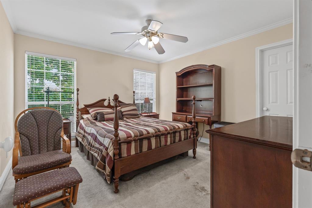 7581 Highway 24 Commerce, TX 75428 - Photo 22 of 40 a bedroom with a bed and a couch