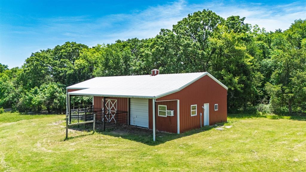 7581 Highway 24 Commerce, TX 75428 - Photo 7 of 40 a view of a house with a yard porch and sitting area