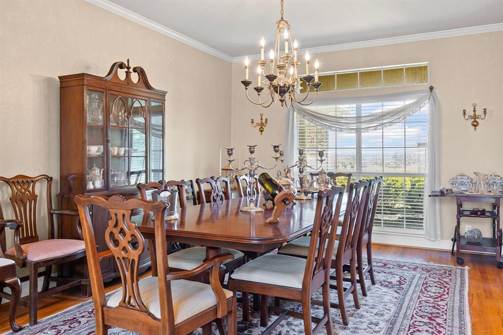 7581 Highway 24 Commerce, TX 75428 - Photo 10 of 40 a view of a dining room with furniture window and wooden floor