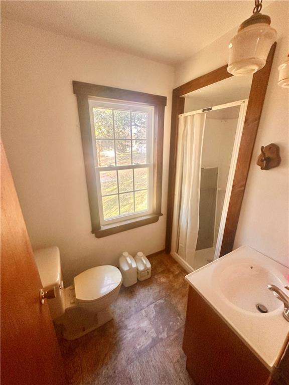 152 Concord Street Perryopolis, PA 15473 - Photo 13 of 18 a bathroom with a sink a toilet and tub