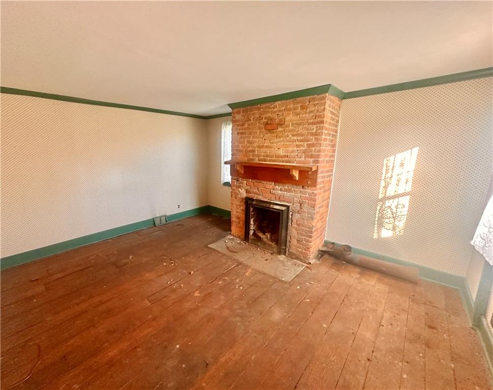 152 Concord Street Perryopolis, PA 15473 - Photo 17 of 18 a view of empty room with fireplace and fan
