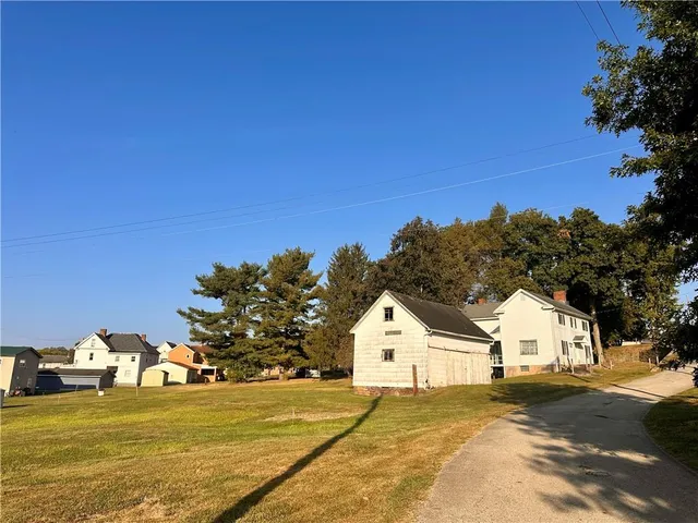 a view of a large house with a yard