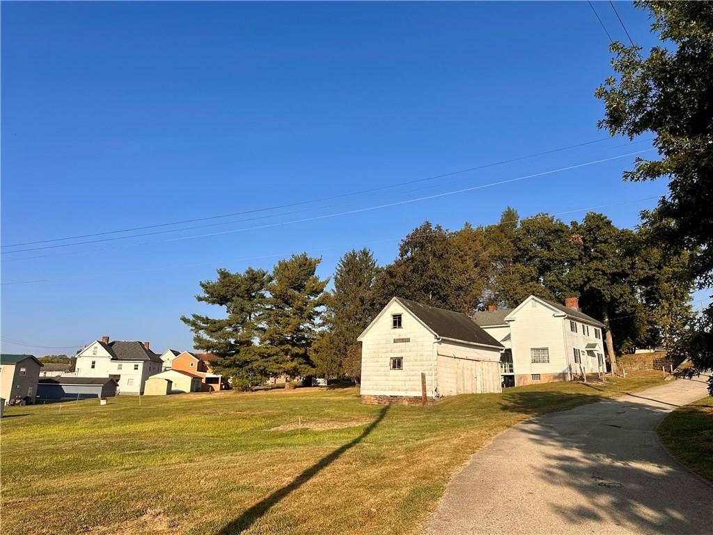 152 Concord Street Perryopolis, PA 15473 - Photo 4 of 18 a view of a large house with a yard