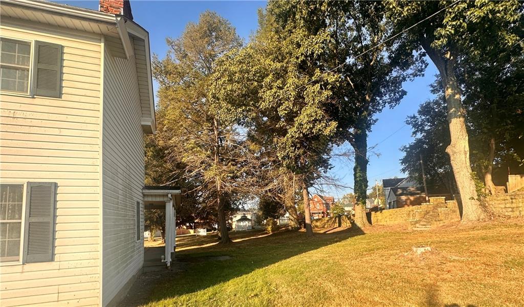 152 Concord Street Perryopolis, PA 15473 - Photo 6 of 18 a view of a yard with snow on the roadside