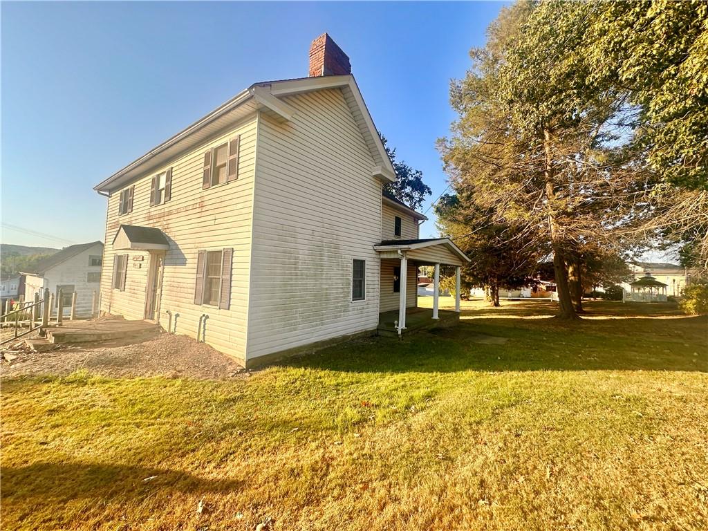 152 Concord Street Perryopolis, PA 15473 - Photo 7 of 18 a view of a house with a yard
