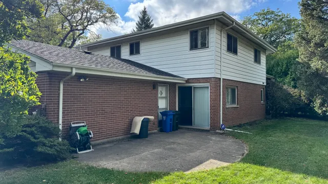 a view of a house with a yard and plants