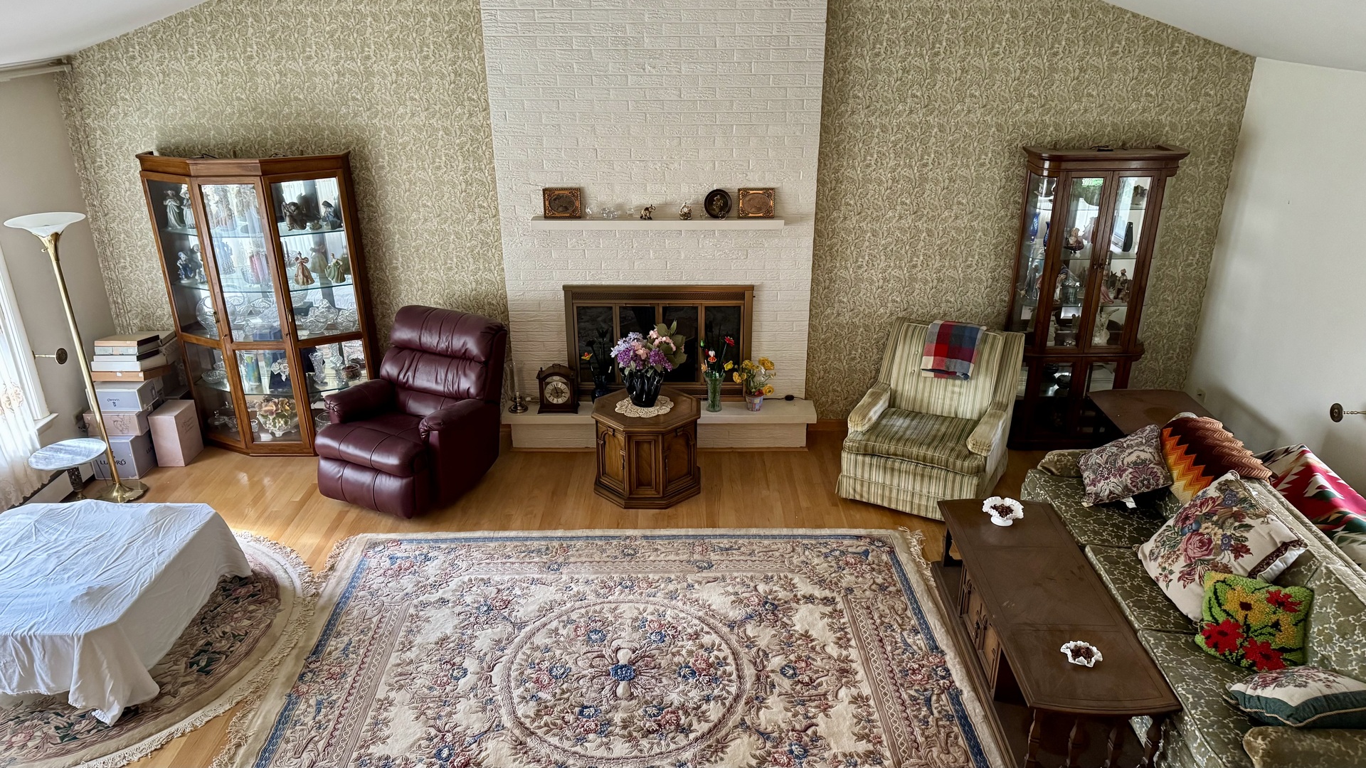 900 East Golfview Drive Mount Prospect, IL 60056 - Photo 6 of 11 a living room with furniture and a fireplace