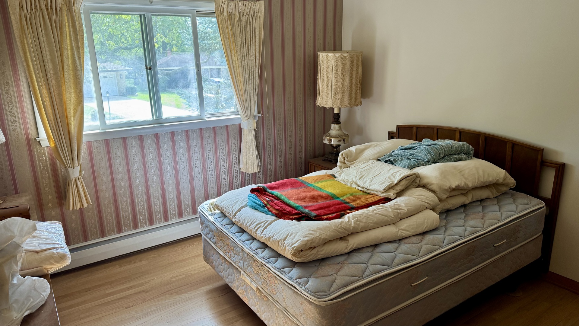 900 East Golfview Drive Mount Prospect, IL 60056 - Photo 10 of 11 a bedroom with furniture and a window