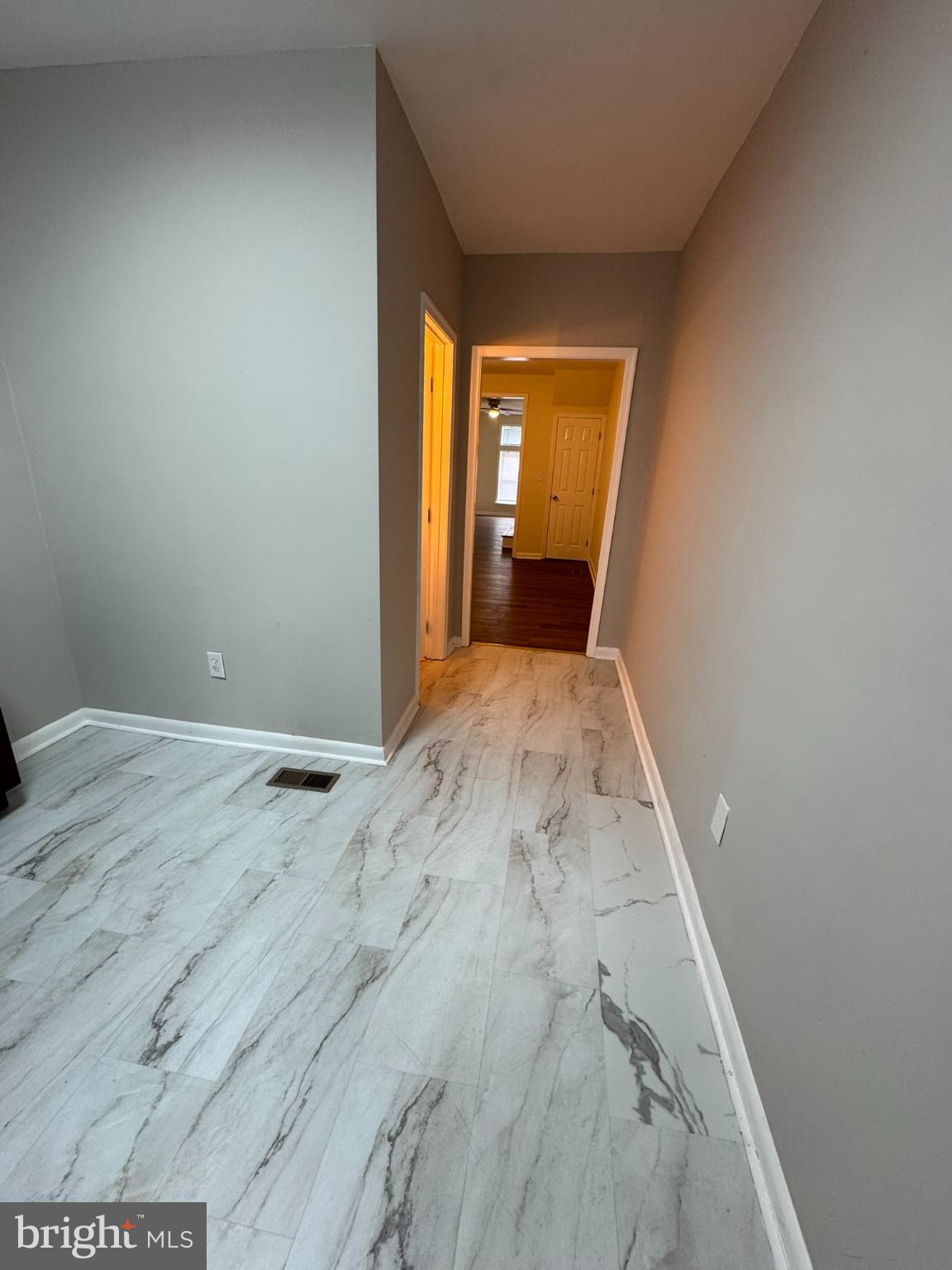 1210 Whitelock Street Baltimore, MD 21217 - Photo 11 of 33 a view of empty room with wooden floor