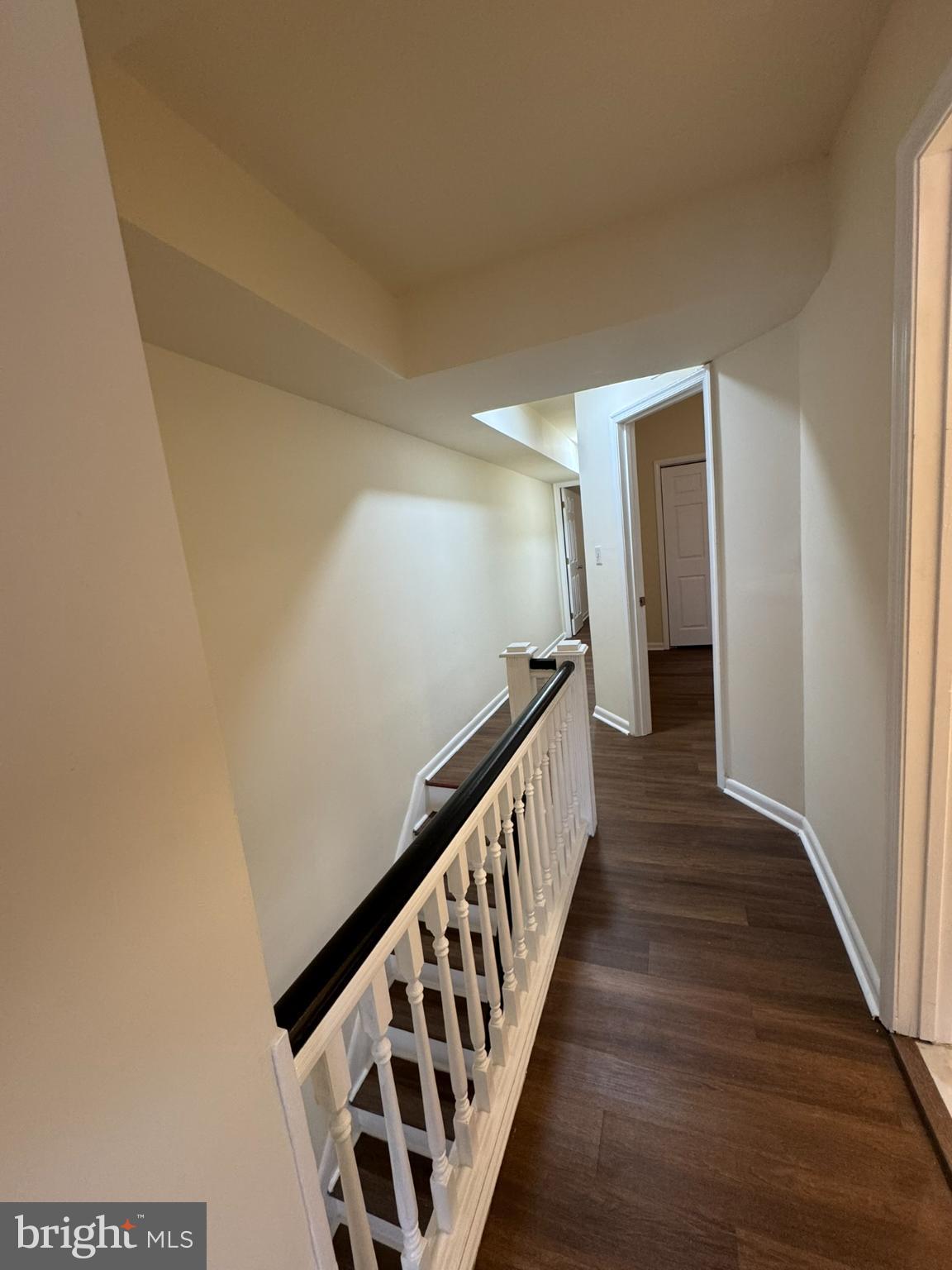 1210 Whitelock Street Baltimore, MD 21217 - Photo 15 of 33 a view of a hallway with wooden floor and staircase