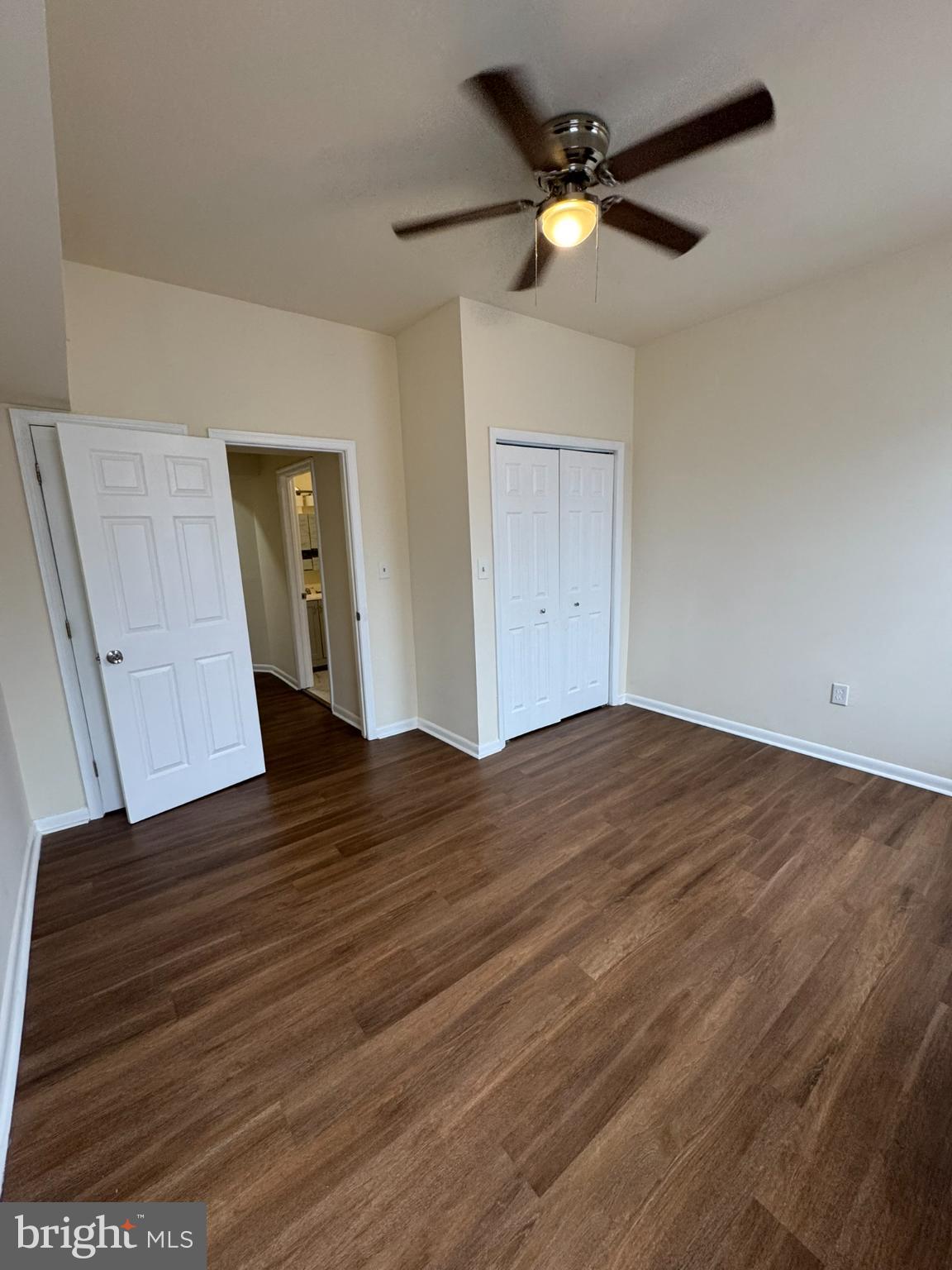 1210 Whitelock Street Baltimore, MD 21217 - Photo 18 of 33 a view of empty room with wooden floor and fan