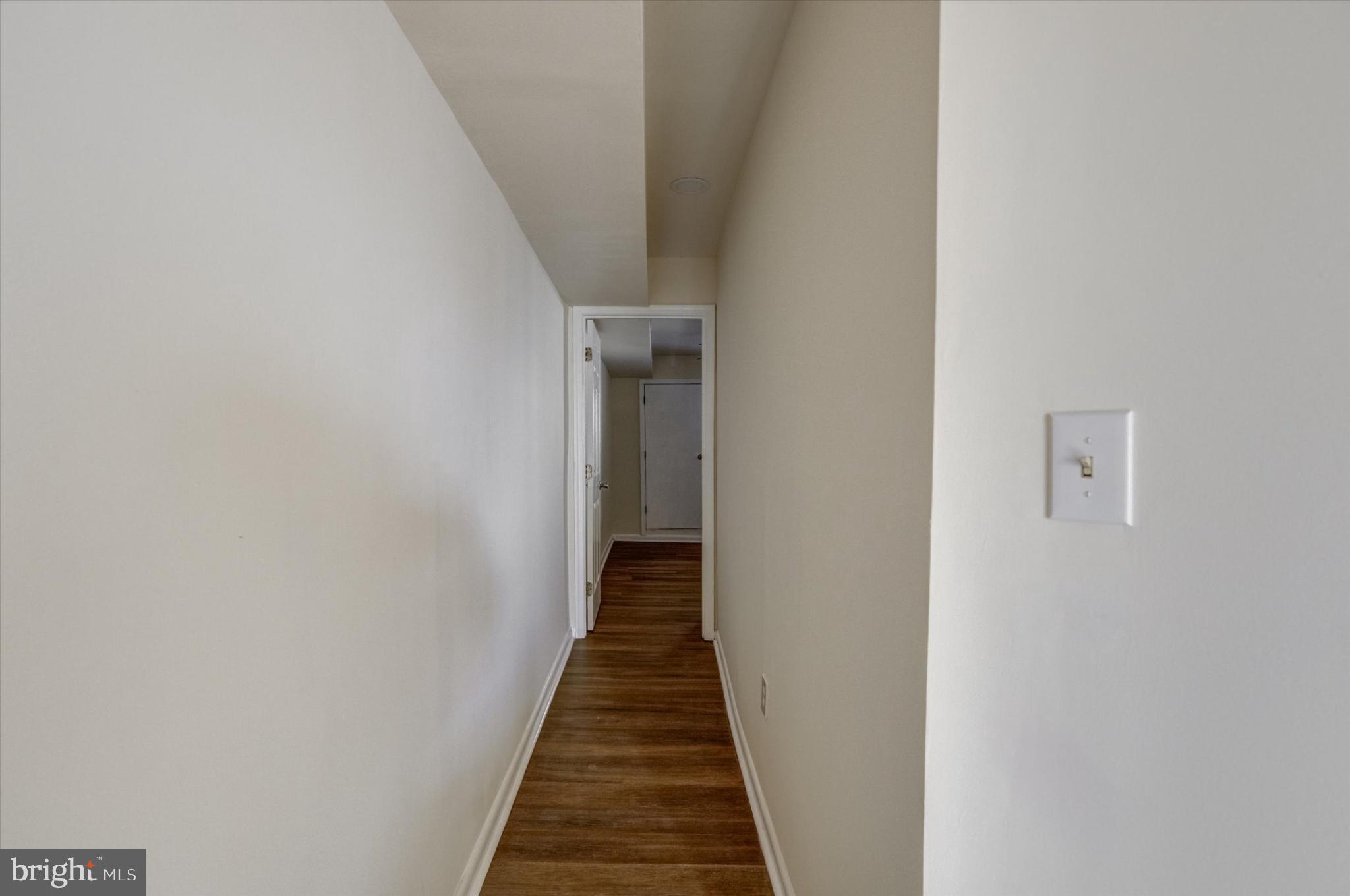 1210 Whitelock Street Baltimore, MD 21217 - Photo 19 of 51 Inviting hallway with warm wooden floors.