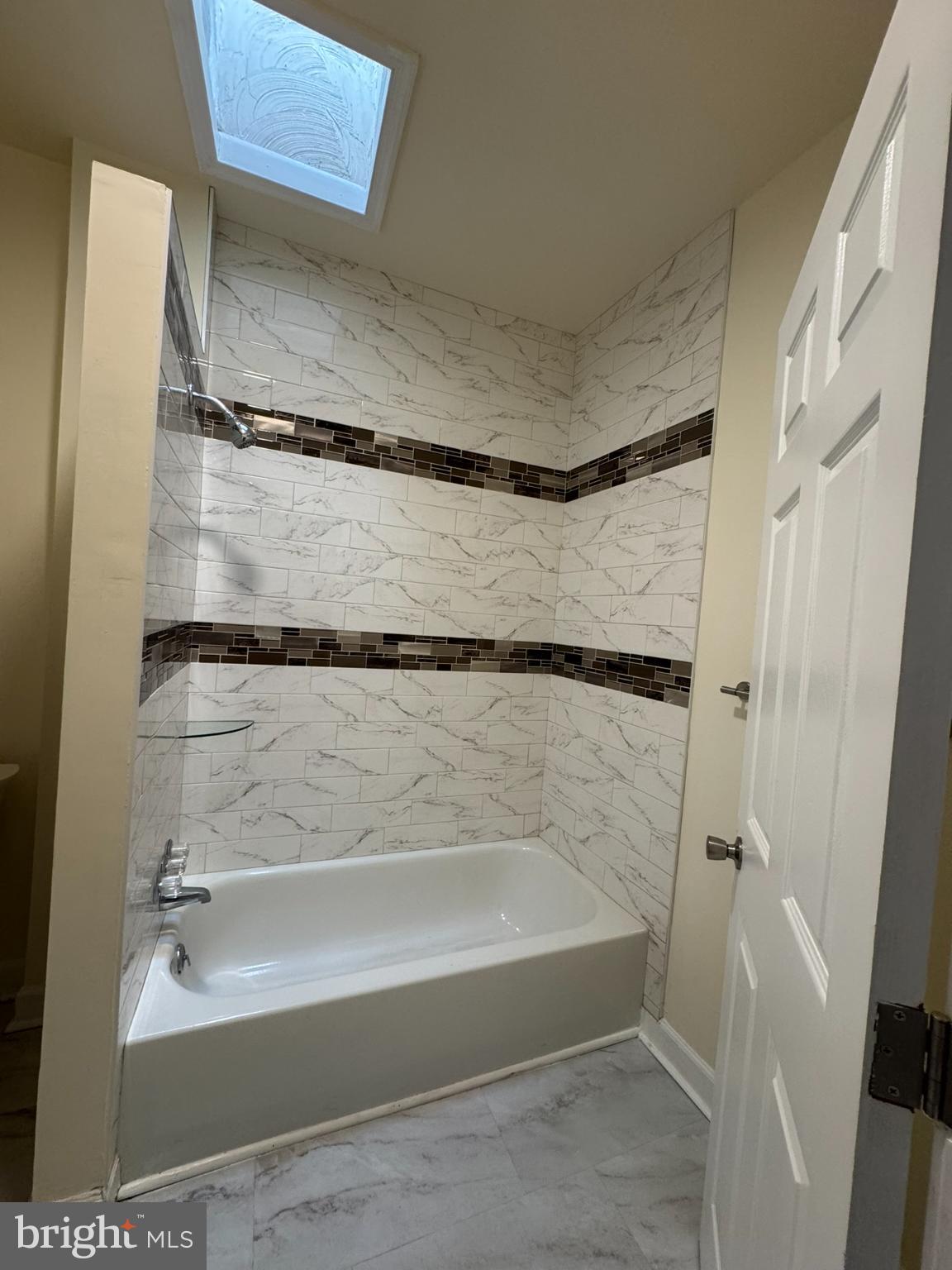 1210 Whitelock Street Baltimore, MD 21217 - Photo 22 of 33 a bathroom with a bathtub and a shower