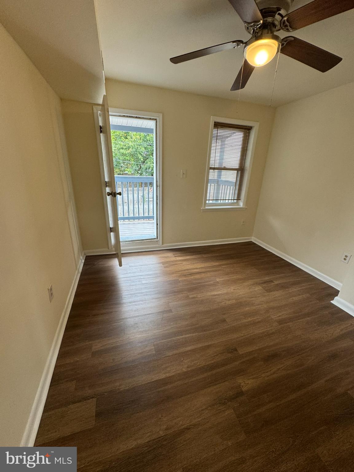 1210 Whitelock Street Baltimore, MD 21217 - Photo 27 of 33 a view of an empty room with window and wooden floor
