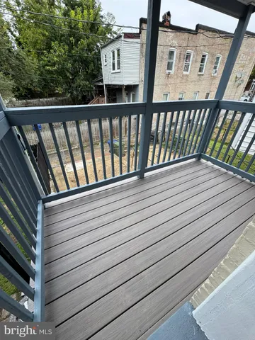a view of balcony with wooden floor