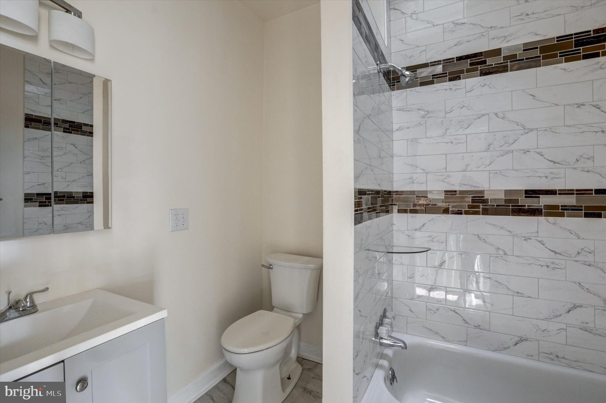1210 Whitelock Street Baltimore, MD 21217 - Photo 38 of 51 Modern bathroom with elegant tile accents.