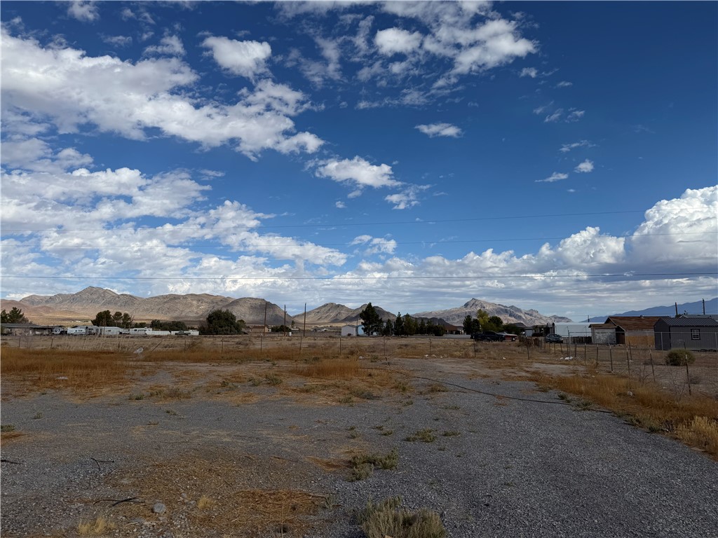 4360 Retread Road Pahrump, NV 89048 - Photo 17 of 19 Expansive desert views stretch across this open lot set against a mountain backdrop.
