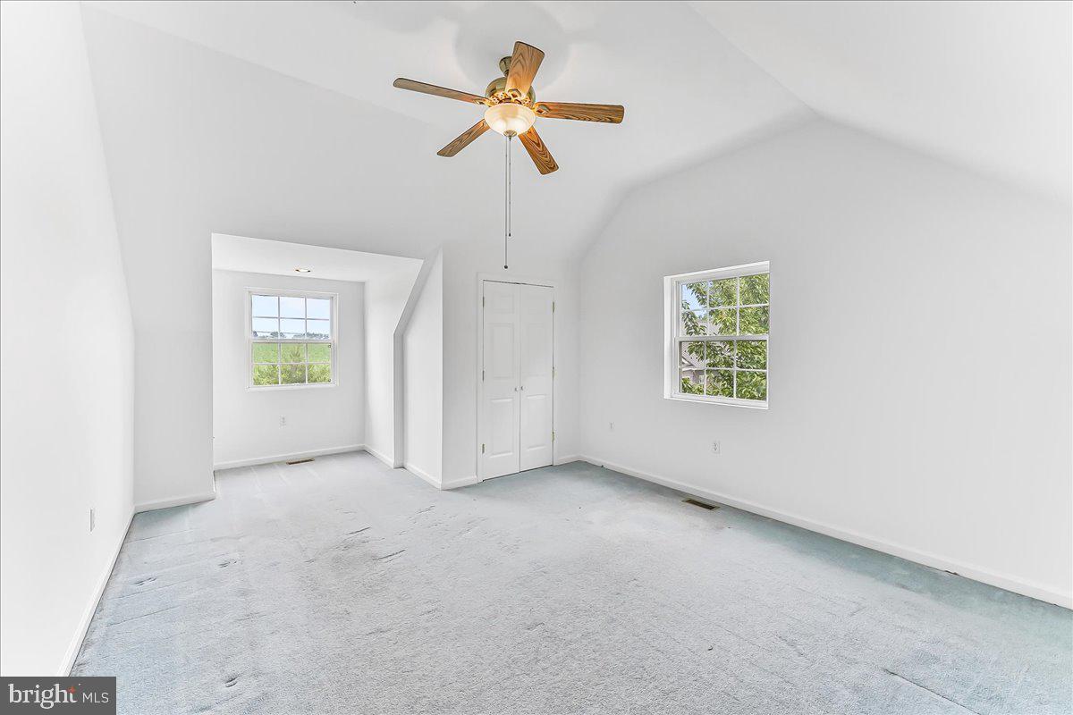 139 High Point Road Cochranville, PA 19330 - Photo 33 of 37 an empty room with windows and ceiling fan