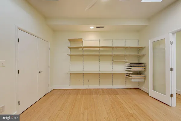 a view of a room with storage and utility room