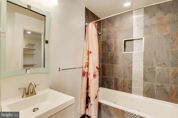 a bathroom with a sink and a shower