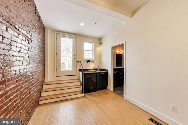 a view of a kitchen cabinets and wooden floor