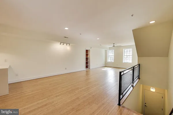 a view of an entryway with wooden floor