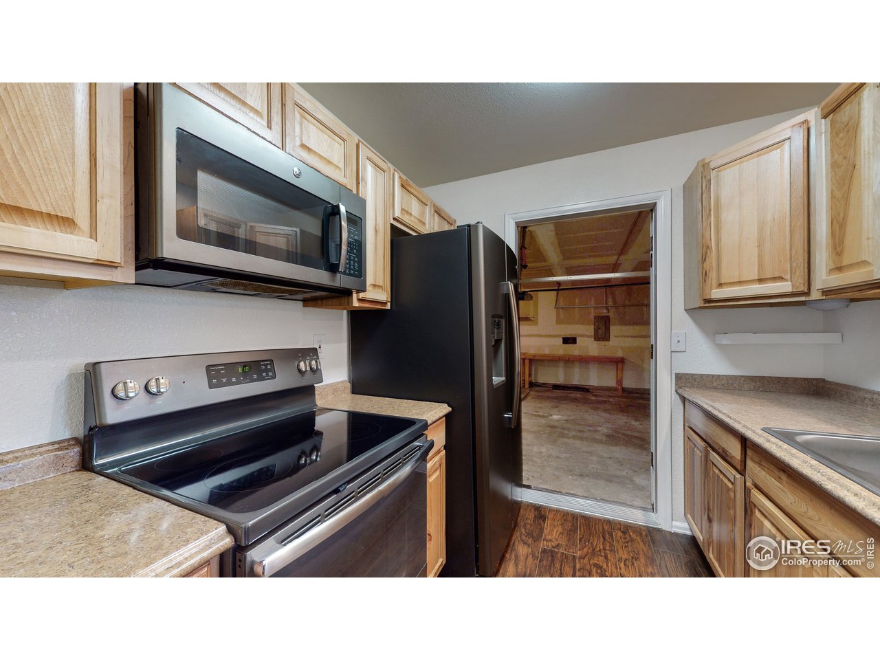 3725 Riverside Parkway Evans, CO 80620 - Photo 11 of 35 Kitchen into Garage