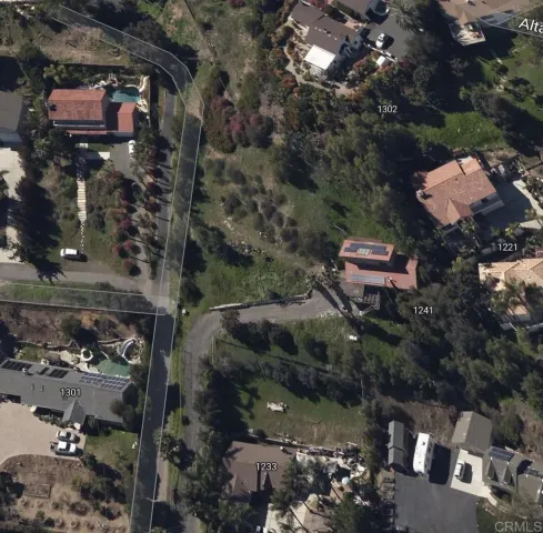 an aerial view of multi story residential apartment building with outdoor space