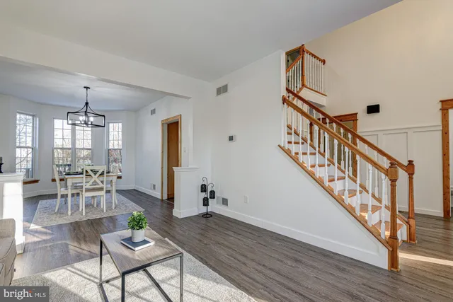a kitchen that has a sink cabinets counter space and appliances