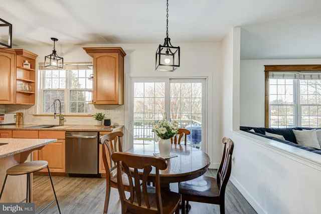 a bathroom with a sink mirror and toilet
