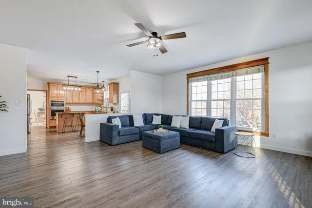 a bedroom with furniture and a flat screen tv