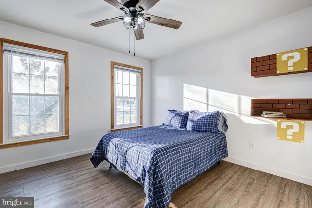 a bathroom with a sink a toilet and shower curtain