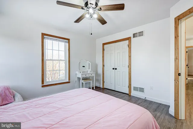 an aerial view of a house with a swimming pool