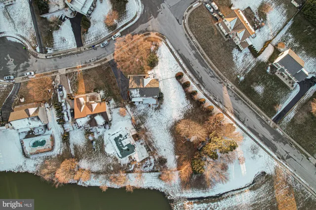 a aerial view of a house with a yard