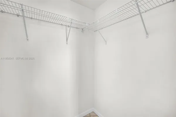 a view of storage and utility room with washer and dryer