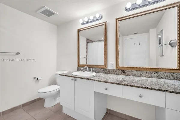 a bathroom with a shower and a toilet