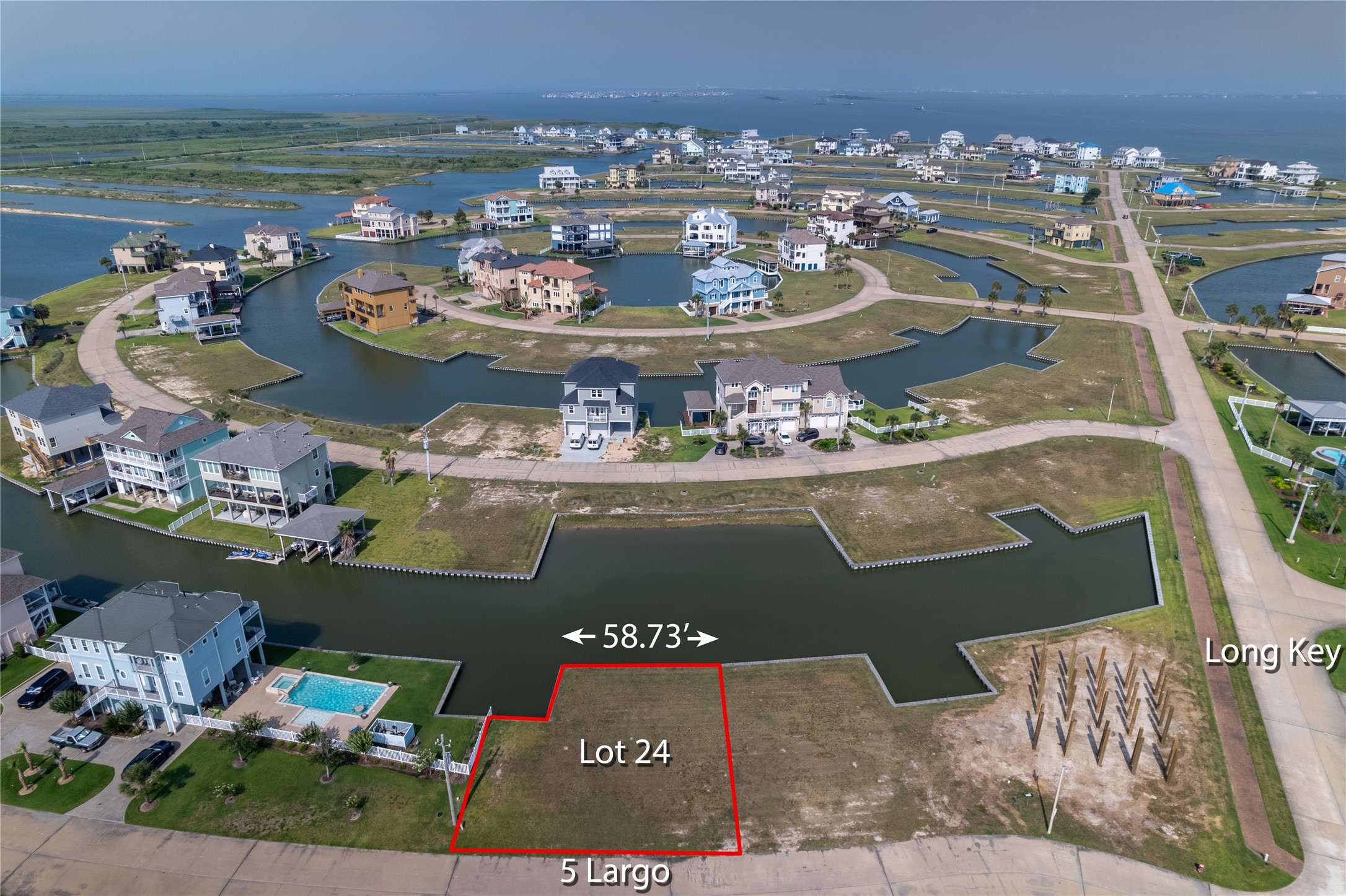 a view of a balcony with dining table and chairs