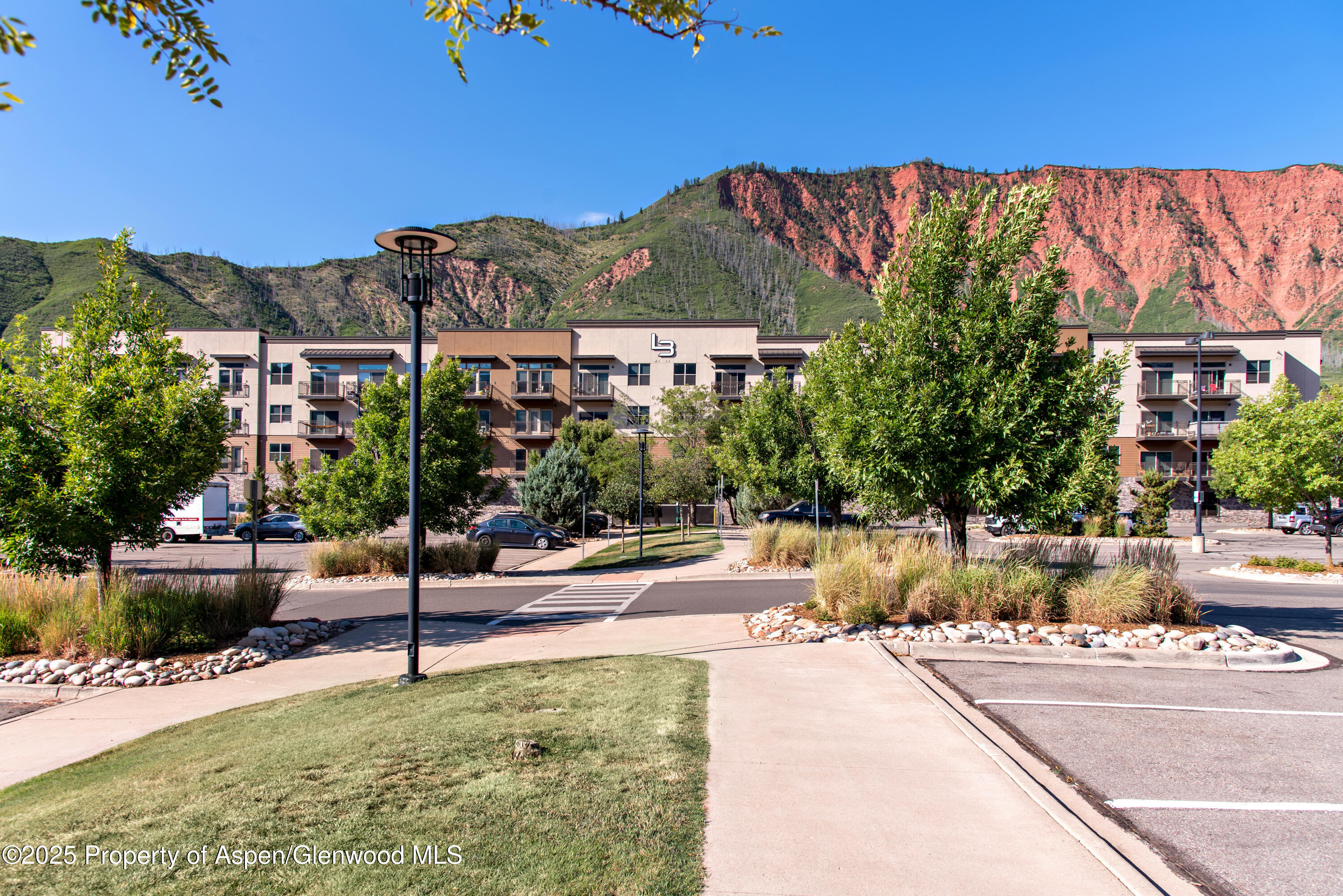 253 Wulfsohn Road, Unit 324 Glenwood Springs, CO 81601 - Photo 8 of 45 a view of a garden with a small pool