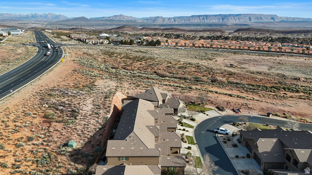 4269 Razor Drive Washington, UT 84780 - Photo 42 of 50 Aerial view of property and surrounding area featuring nearby suburban area and a mountainous background
