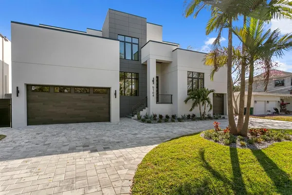 a house with palm tree in front of it
