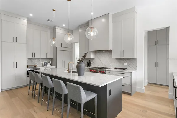 a kitchen with a sink and a large window
