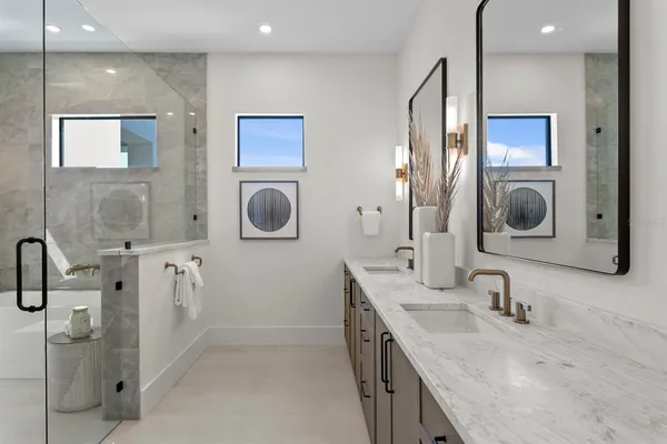a view of a house with backyard porch and sitting area