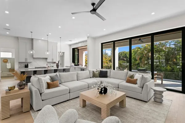 a kitchen with cabinets and wooden floor