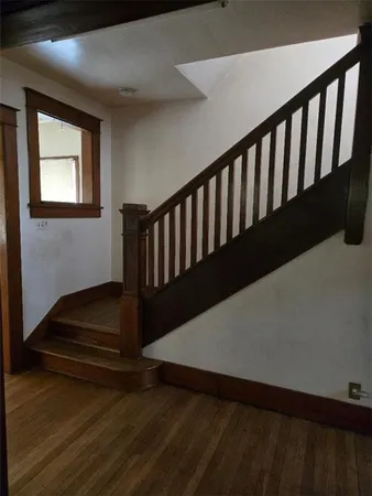 a hallway with wooden floor
